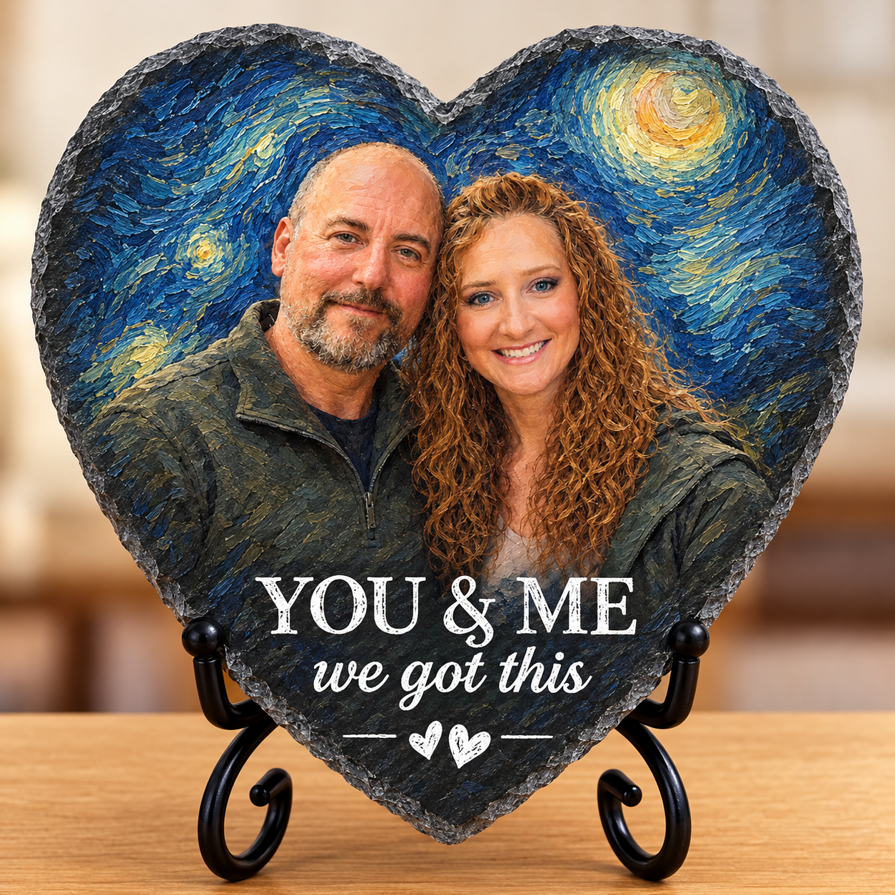 Heart-shaped portrait plaque of Kimme and Andy beneath a painted starry sky, with the inscription ‘You & me, we got this.’
